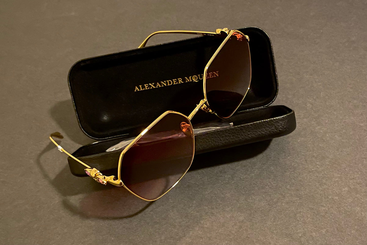 Alexander McQueen® AM0325S Glasses purple diamonds and gold skull ￼