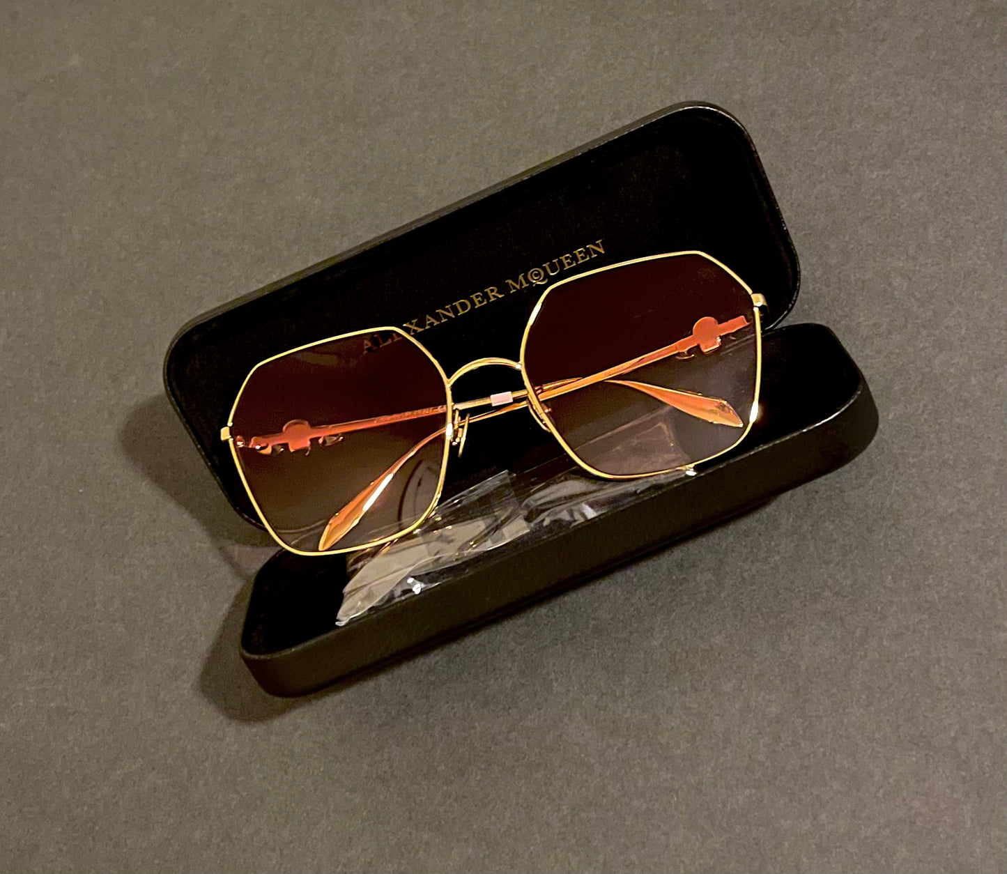 Alexander McQueen® AM0325S Glasses purple diamonds and gold skull ￼